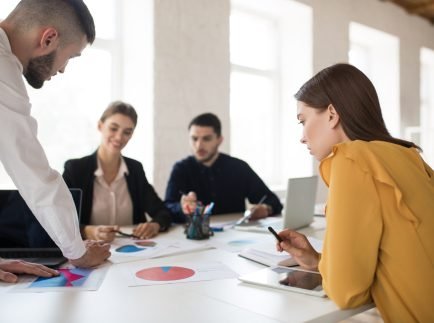 Group of creative people working together on new project  in modern office